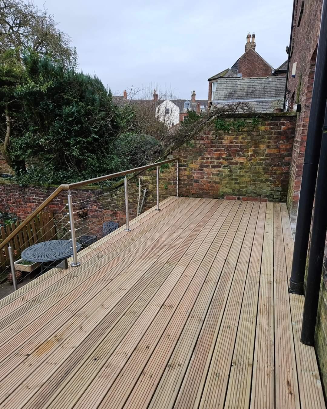 New timber boards on the same raised deck and cable railing