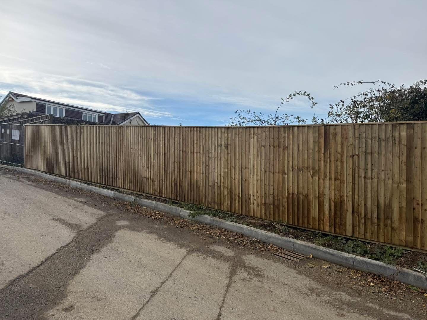 New closeboard fence along a lane