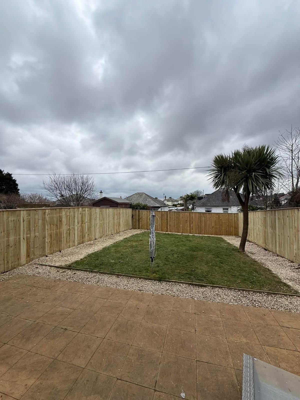 Closeboard fence around the same lawn
