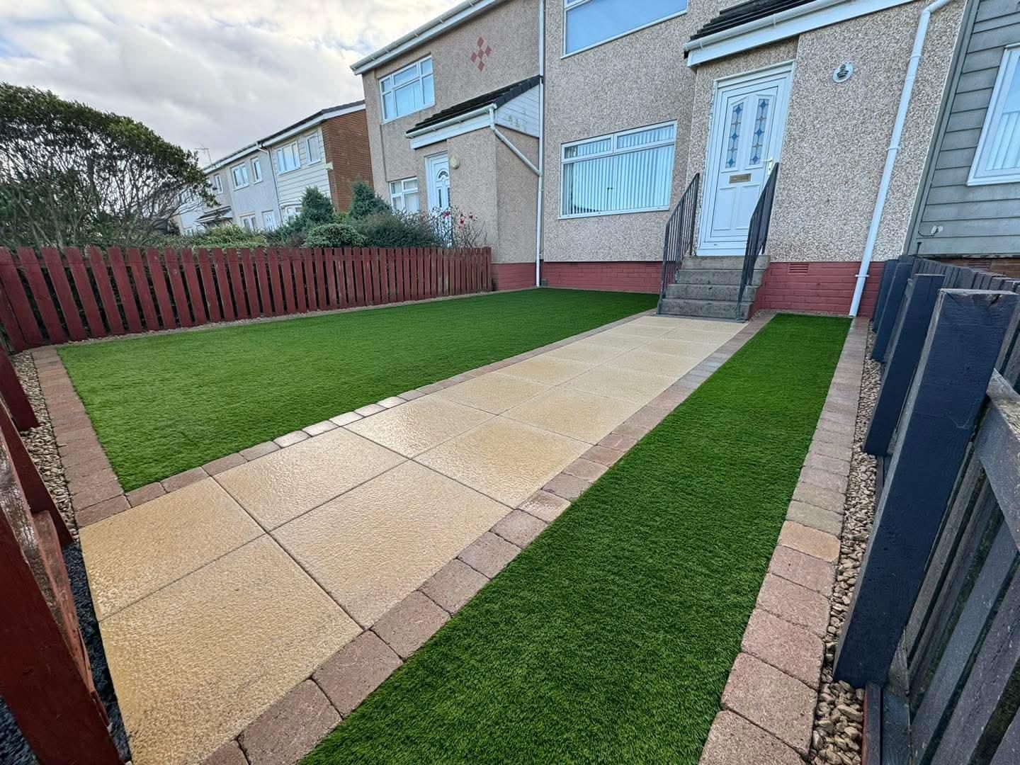 Artificial grass either side of a new slab path